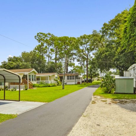 A beautiful, well-maintained home in Lake Letta RV Park, surrounded by lush greenery in the serene 55+ community of Avon Park, FL.