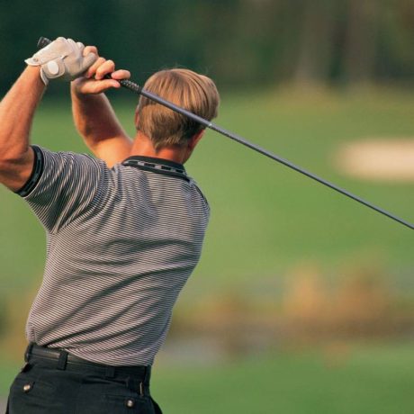 A man playing golf